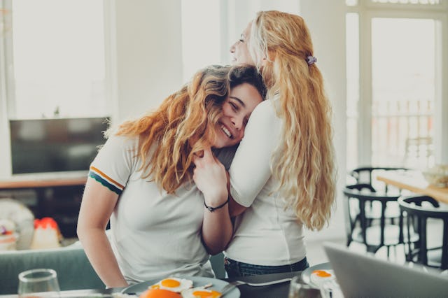 Mother embraces her daughter, mom mentor