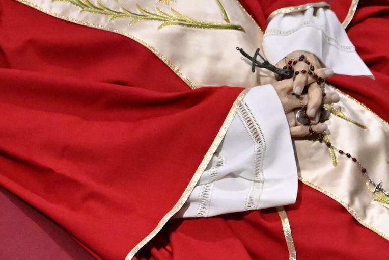This photograph shows a close up of the hands of Pope Emeritus Benedict XVI Lying in state at St Pet...