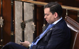 Newly elected Republican Representative from New York George Santos looks on as the US House of Repr...