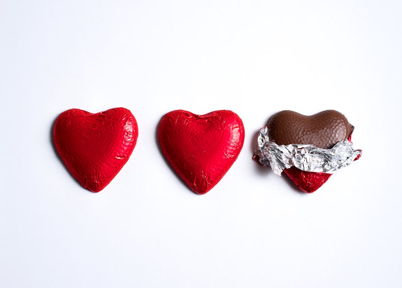 row of foil-wrapped chocolate hearts in an article about dirty valentine's day jokes