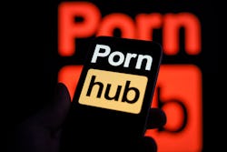 The Pornhub logo is seen on an iPhone mobile device in this illustration photo in Warsaw, Poland on ...