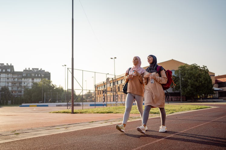 Two friends go for a walk to reach their step goals of 8,000 steps a day for the 3-2-8 method. 