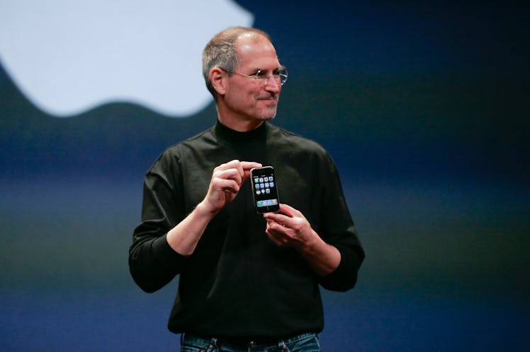 Apple Computer Inc. Chief Executive Officer Steve Jobs holds the new iPhone in San Francisco, Califo...
