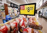 People shop at a supermarket in Montebello, California, on August 23, 2022. - US shoppers are facing...