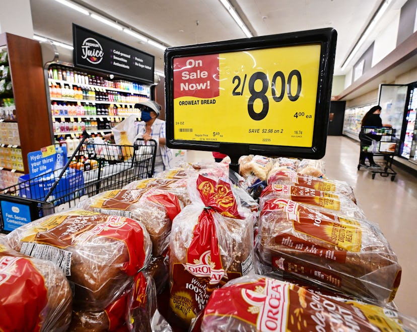 People shop at a supermarket in Montebello, California, on August 23, 2022. - US shoppers are facing...