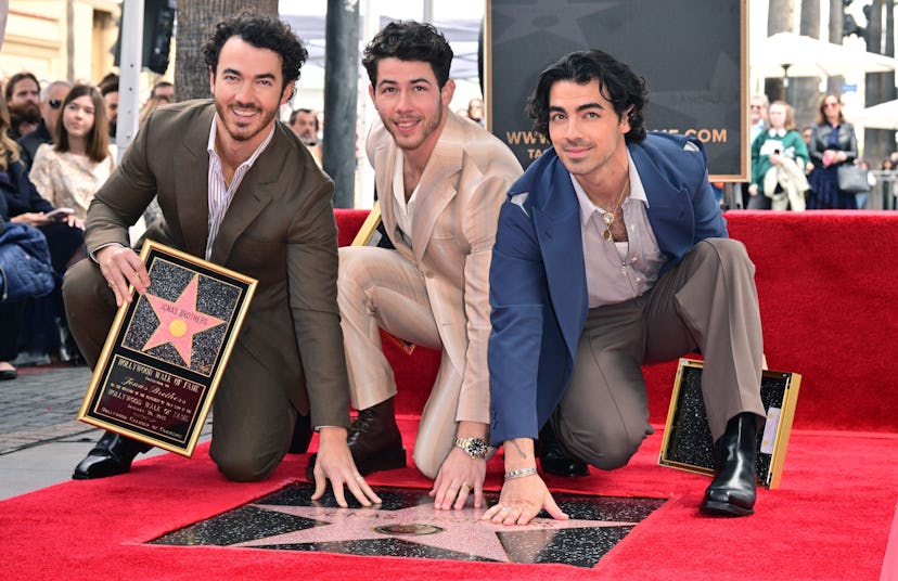 Kevin, Nick, and Joe Jonas of The Jonas Brothers receive their Hollywood Walk of Fame star. Photo by...