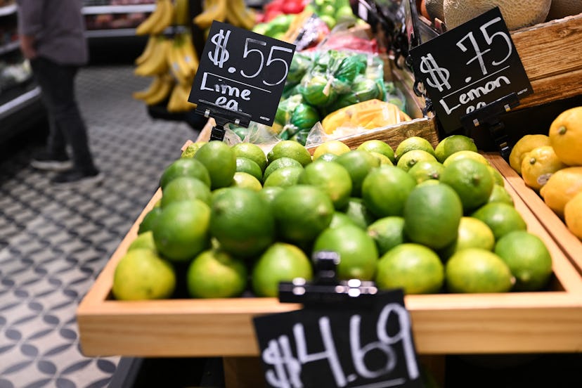 Limes, lemons and other fresh fruit is priced for sale inside a retail grocery store on July 13, 202...