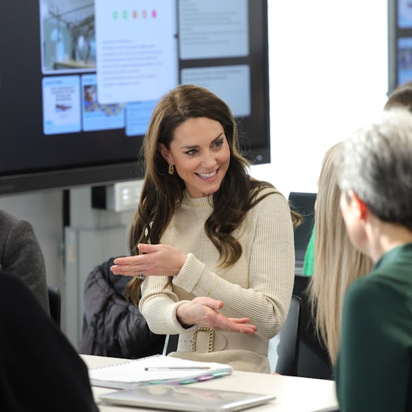 Kate Middleton wearing a cream ribbed-knit dress by Victoria Beckham.