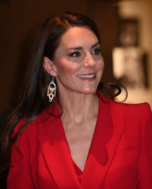 Kate Middleton stepped out wearing a red Alexander McQueen power suit.