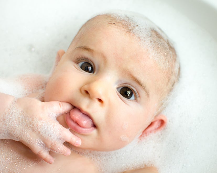a baby in the bath, in an article about how to get rid of cradle cap treatments