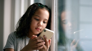 A teen girl on social media. A new study finds social media use is linked to neural sensitivity when...