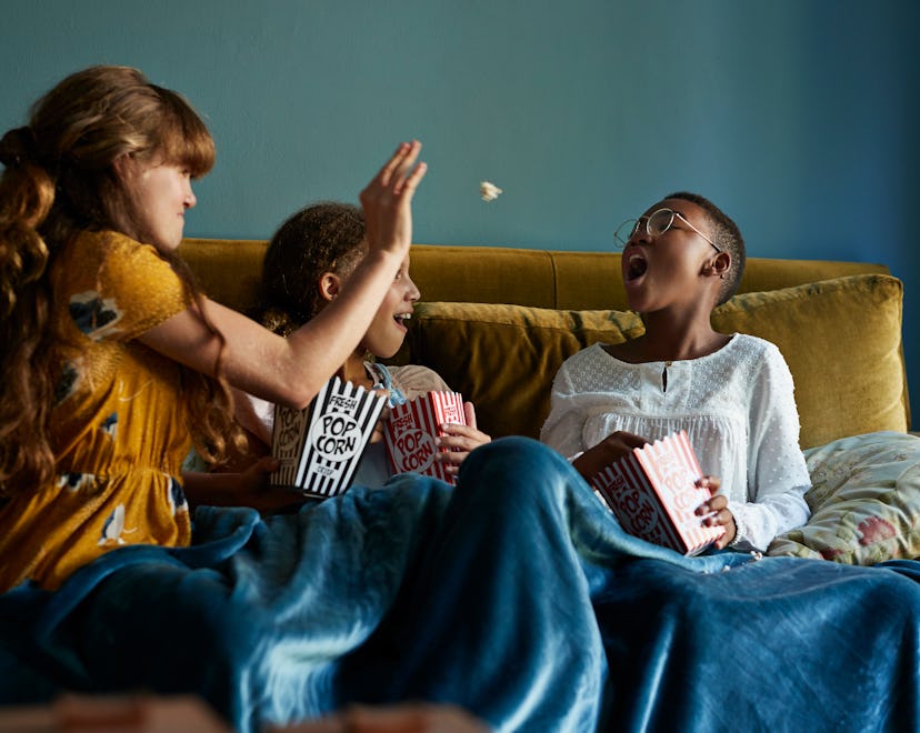 kids eating popcorn in an article about can toddlers eat popcorn
