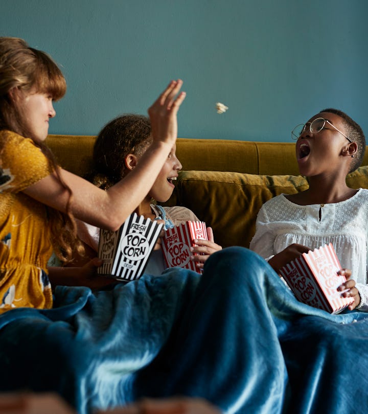 kids eating popcorn in an article about can toddlers eat popcorn