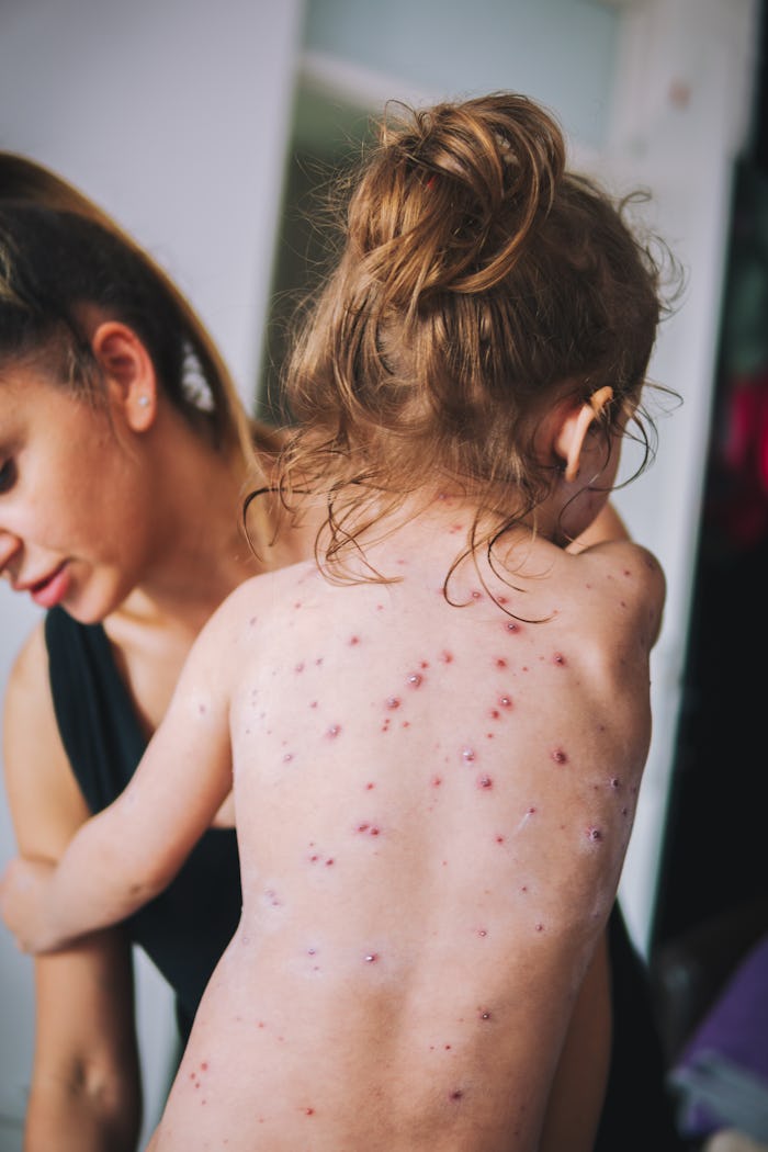 Mother nursing sick child At Home