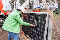 LÜTZERATH, GERMANY - DECEMBER 20: Greenpeace activists mount solar panels onto a tower on December 2...