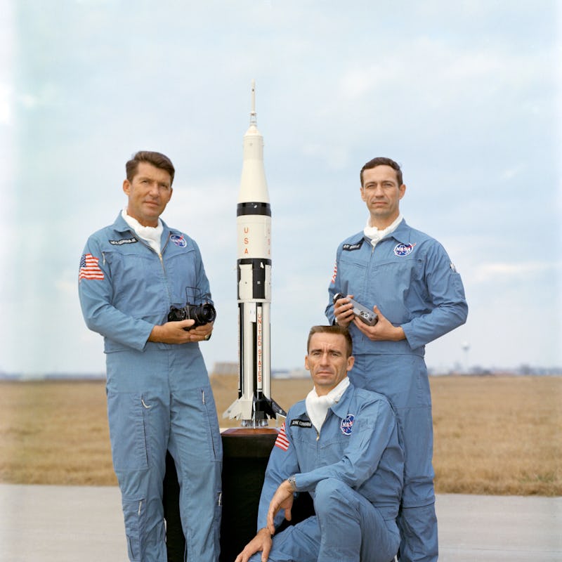 This is a portrait of the Apollo-Saturn 7 crew members. They are, left to right, astronauts Walter M...