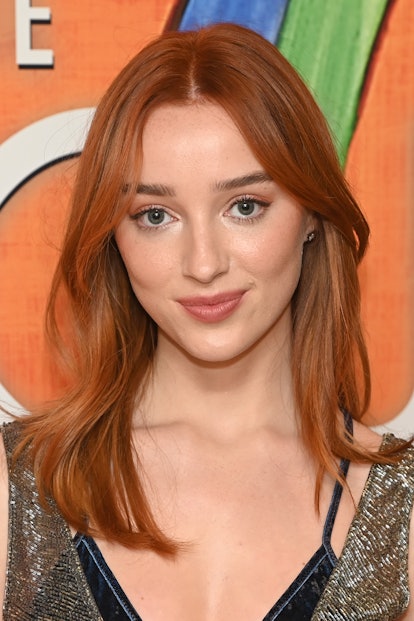 Phoebe Dynevor with copper hair, a huge spring hair color trend for 2023, attending a screening of "...