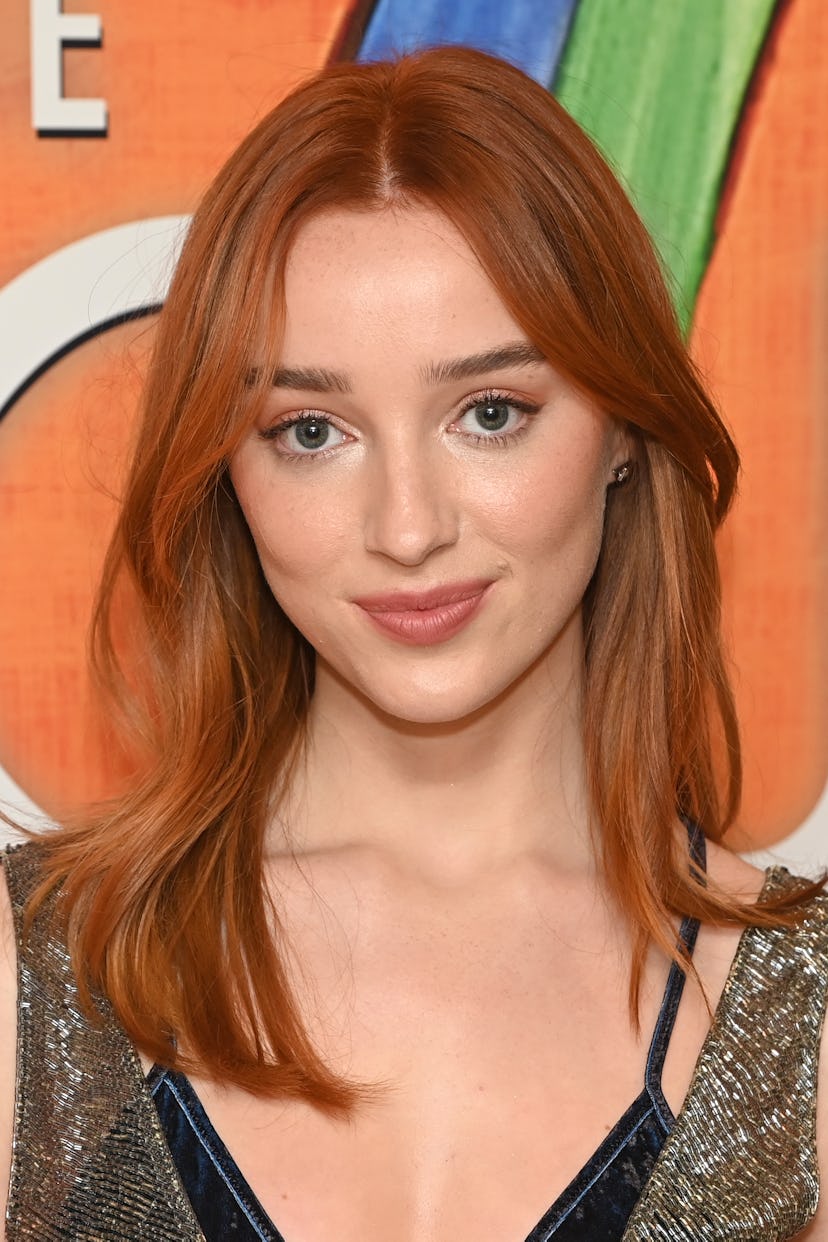 Phoebe Dynevor with copper hair, a huge spring hair color trend for 2023, attending a screening of "...