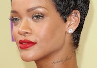 Rihanna cursive neck tattoo with pixie cut and red lip at the 2012 MTV Video Music Awards at Staples...