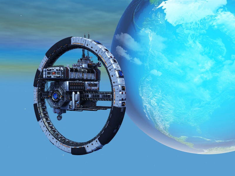 A space station wheel orbiting planet Earth. The space station wheel is a habitat that a human crew ...