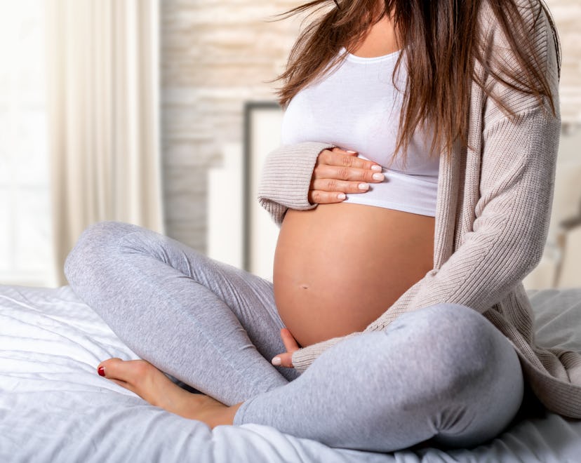 pregnant woman in an article about can you dilate without losing mucus plug