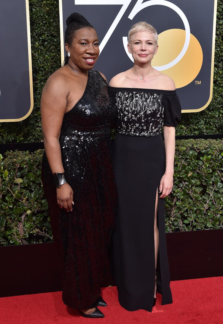 Activist Tarana Burke (L) and actress Michelle Williams attend the 75th Annual Golden Globe Awards 