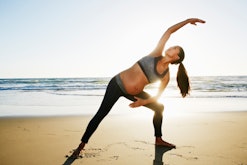 pregnant woman exercising in an article about cramps after walking during pregnancy