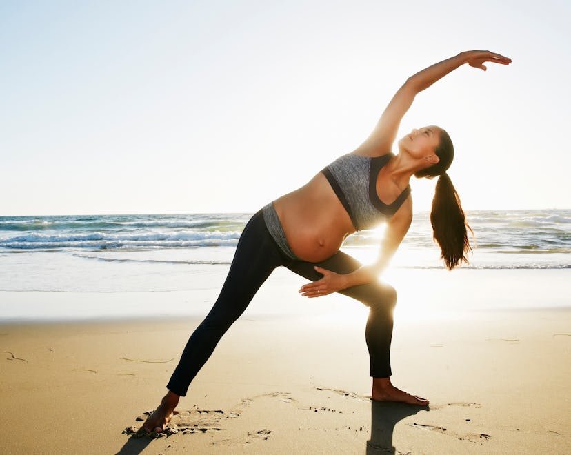 pregnant woman exercising in an article about cramps after walking during pregnancy