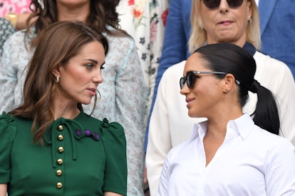 Catherine, Duchess of Cambridge and Meghan, Duchess of Sussex in the Royal Box on Centre Court at Wi...