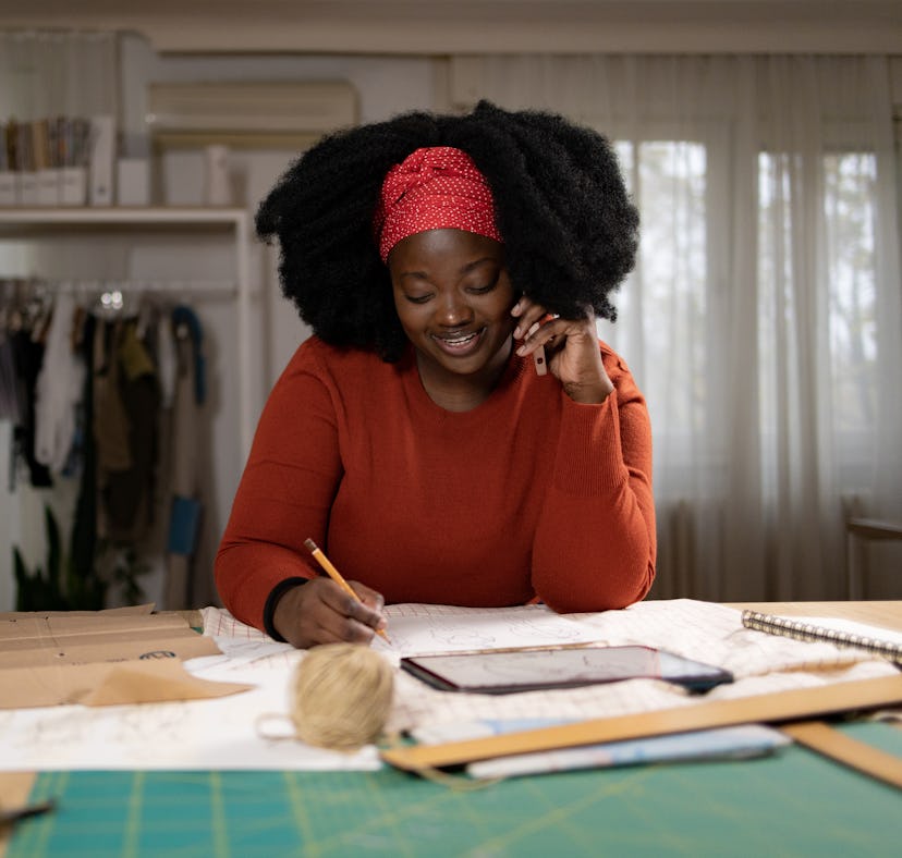 a woman maps out her career goals, which are represented in her 10th house of astrology
