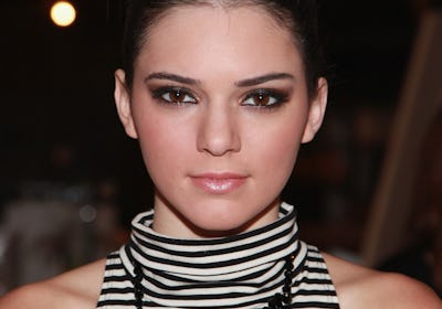 Young Kendall Jenner with bun and statement necklace at the Evening Sherri Hill spring 2013 fashion ...