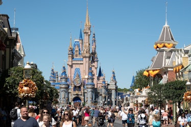 Visitors walk along Main Street at The Magic Kingdom as Walt Disney World reopens following Hurrican...