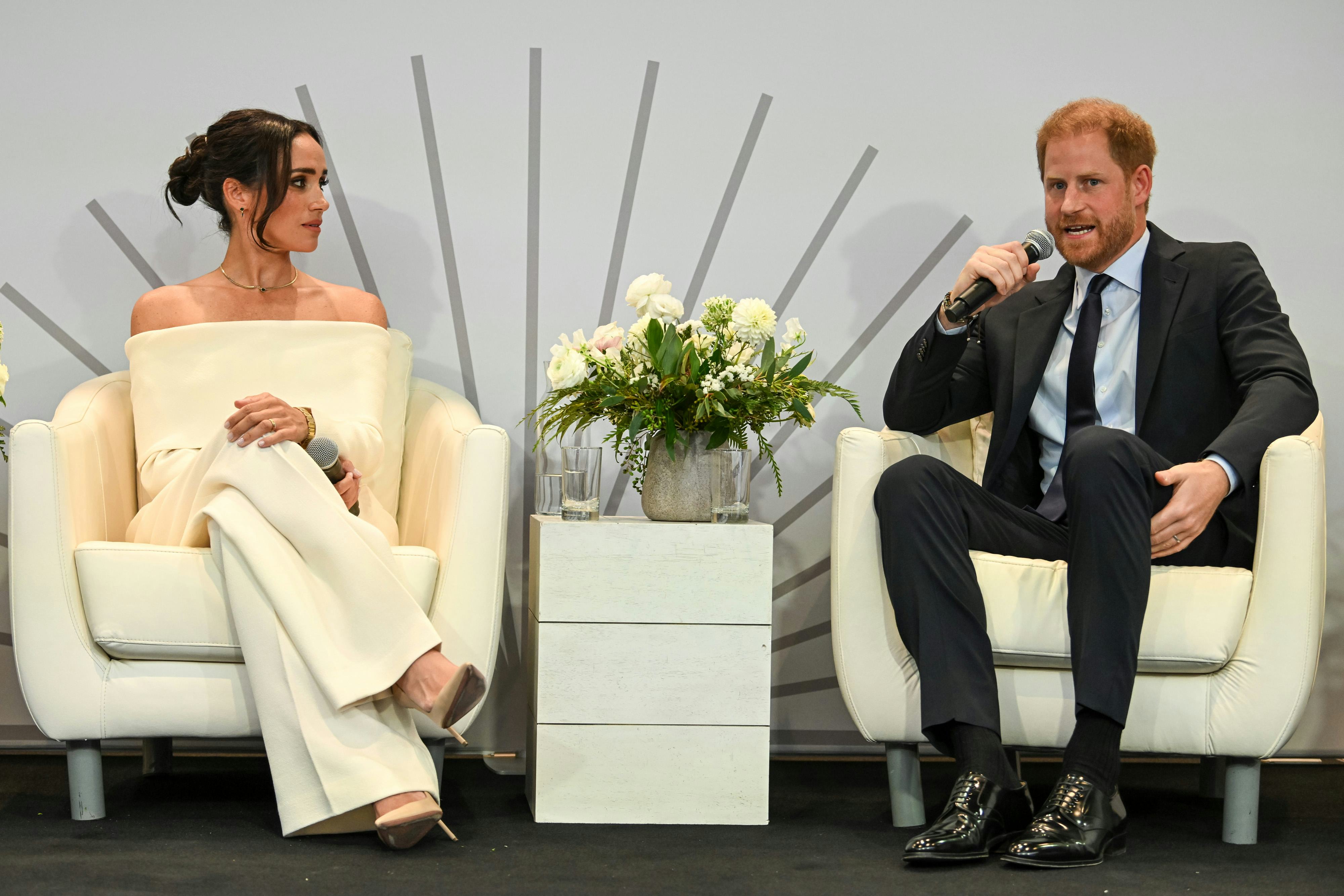 Meghan Markle s Off the Shoulder Power Suit Is Peak Stealth Dressing