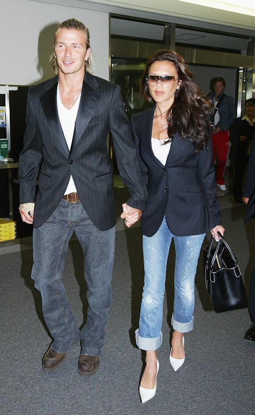 NARITA, JAPAN  - JUNE 18:  English footballer David Beckham and his wife Victoria arrive at New Toky...
