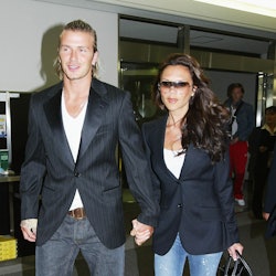 NARITA, JAPAN  - JUNE 18:  English footballer David Beckham and his wife Victoria arrive at New Toky...