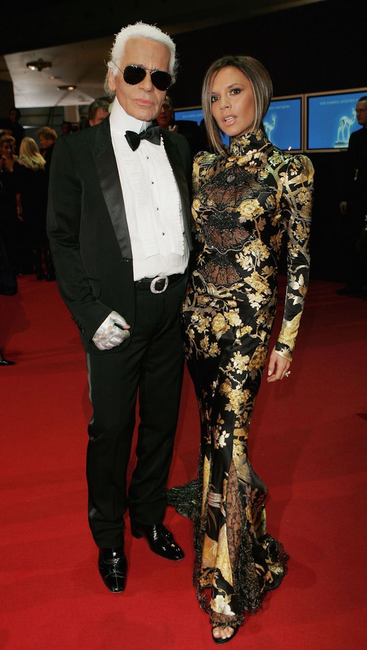 Designer Karl Lagerfeld (L) and Victoria Beckham attend the 58th annual Bambi Awards