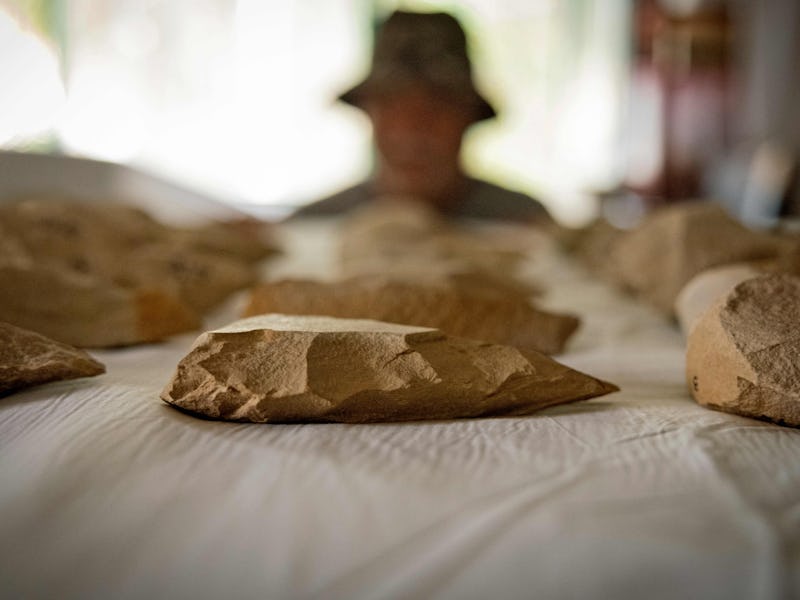 The guardian of the archaeological site "Thomas Quarry I" shows Acheulean stone tools in the Morocca...