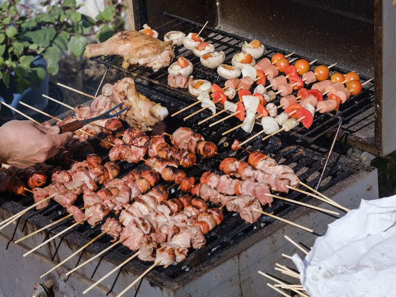 Preparation of Chicken, Meat and Vegetable Kebab on grill