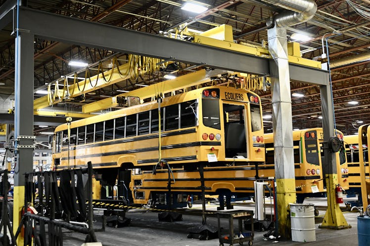 Electric school buses are seen on the assembly line of the Lion Electric plant in Saint-Jérôme, Queb...