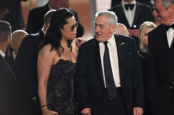 CANNES, FRANCE - MAY 20: Tiffany Chen and Robert De Niro depart the "Killers Of The Flower Moon" red...