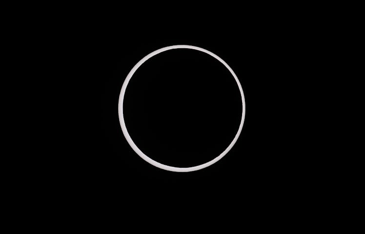 CAPITOL REEF NATIONAL PARK, UTAH - OCTOBER 14:  The moon crosses the sun completing its maximum ecli...