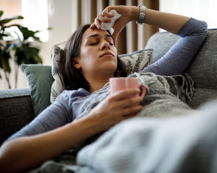 Sick woman lying in bed, in a story answering the question, why is hand, foot, and mouth worse for a...