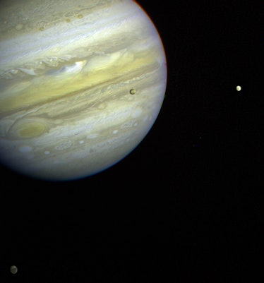 Jupiter, its Great Red Spot and three of its four largest satellites are visible in this photo taken...