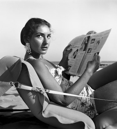 American opera singer Maria 'Callas' Kalogheropoulos liyng on a air mattress on Venice Lido beach, w...