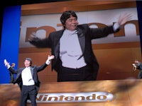 Legendary video game designer Shigeru Miyamoto uses a new wireless 'Wii Remote' to control the tempo...