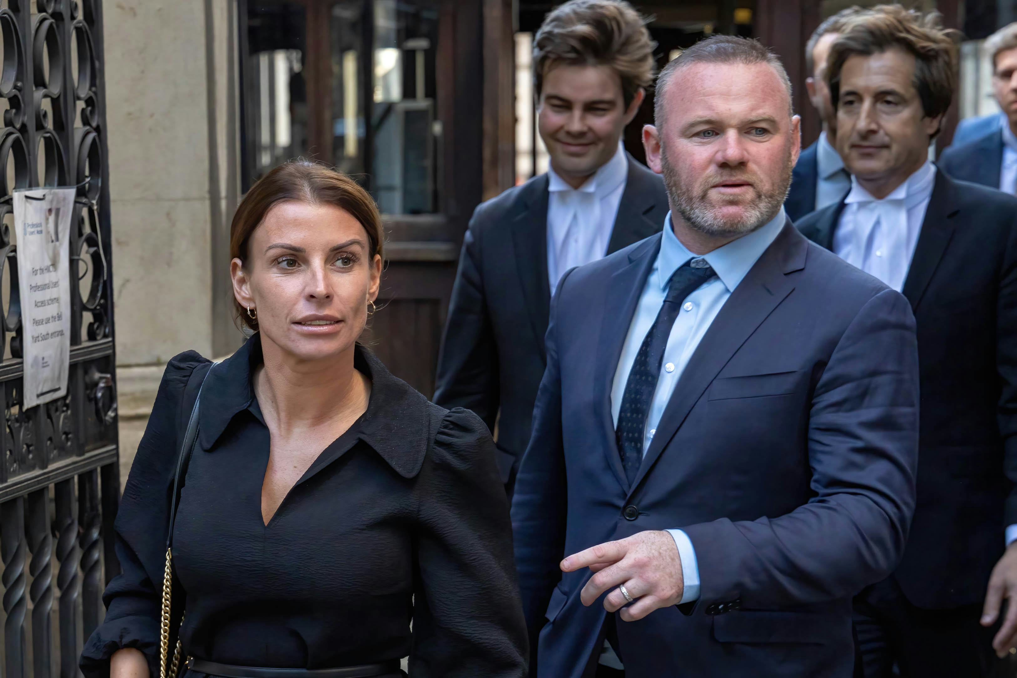Coleen Rooney and her husband Wayne leave court during the &ldquo;Wagatha Christie&rdquo; libel trial.