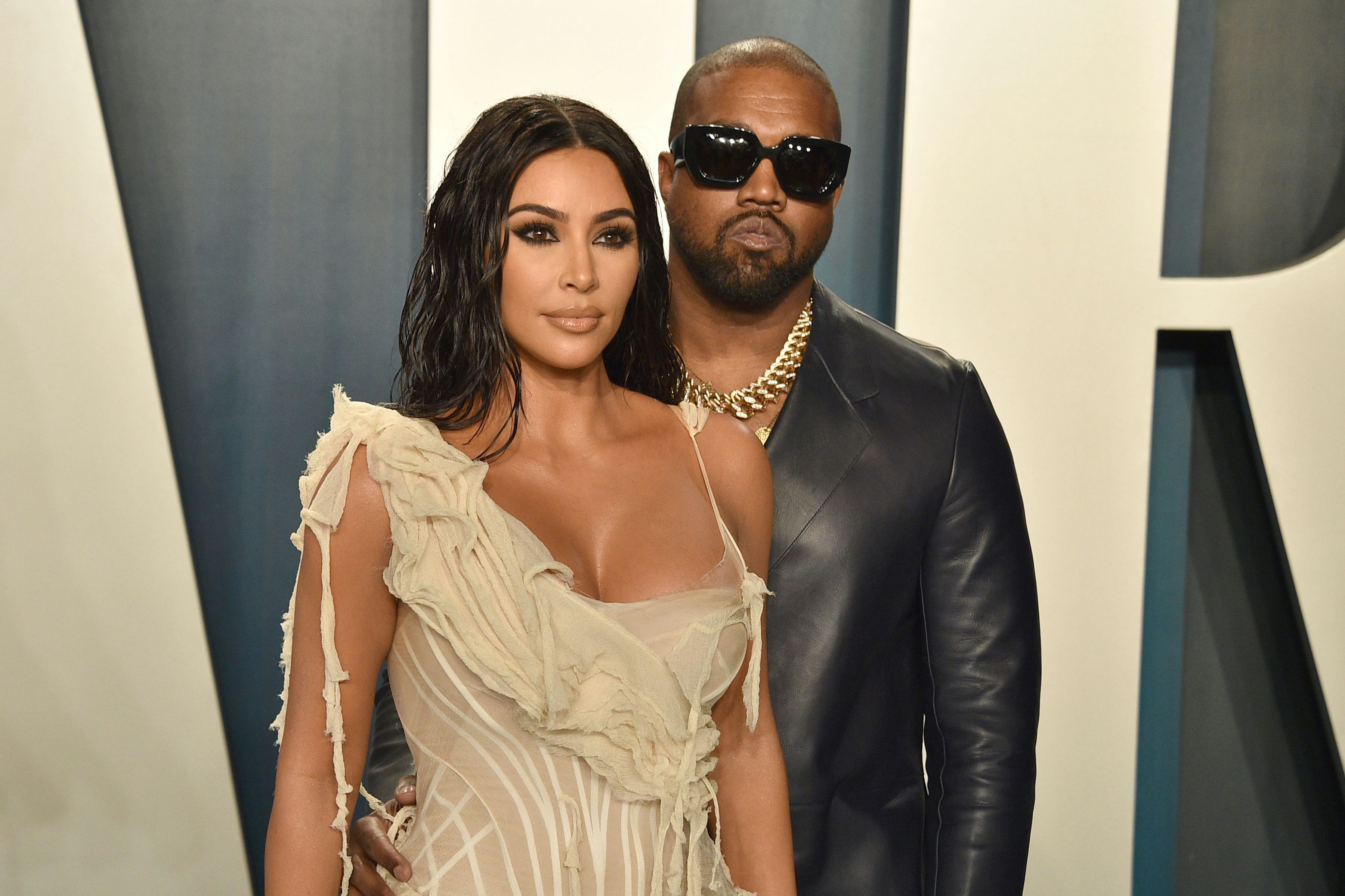 Kim Kardashian and ex-husband Kanye West pose on the red carpet before their divorce.
