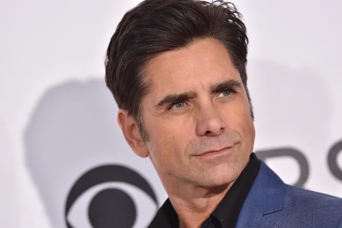 LOS ANGELES, CA - JANUARY 18: Actor John Stamos arrives at the 2017 People's Choice Awards at Micro...