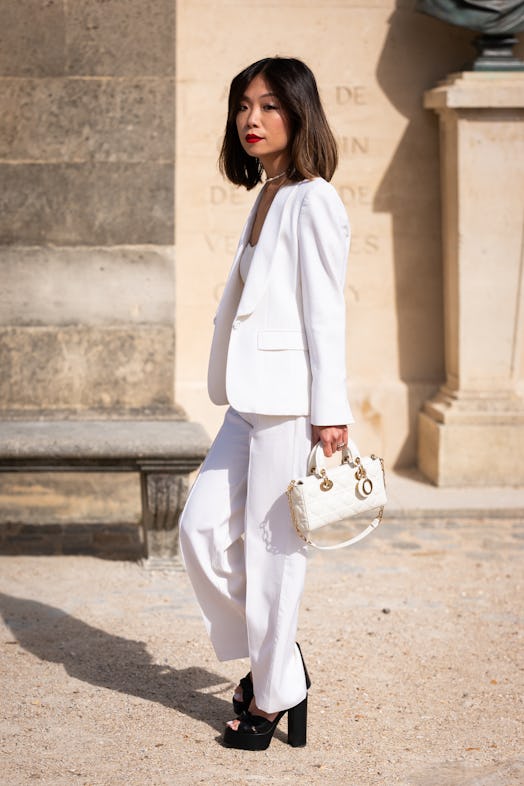 Red lips are a Paris Fashion Week Spring/Summer 2024 street style beauty trend