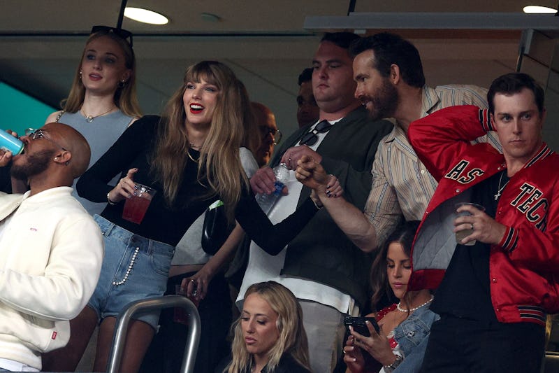 Taylor Swift and Actor Ryan Reynolds talk prior to the game between the Kansas City Chiefs and the N...